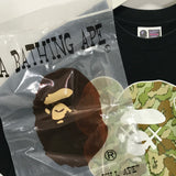 [M] A Bathing Ape x Kaws Cloud Camo Bape Head Logo Tee Black